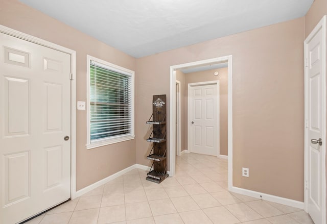 8726 Tilgham St, Houston, TX 77029 - entrance foyer featuring baseboards and light tile patterned floors