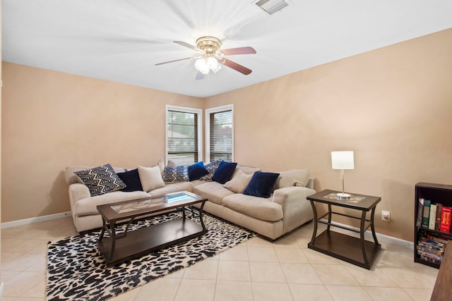 8726 Tilgham St, Houston, TX 77029 - tiled living room featuring a ceiling fan and baseboards