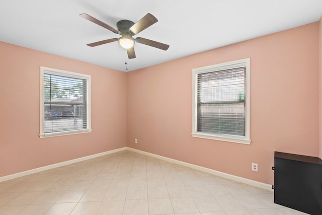 8726 Tilgham St, Houston, TX 77029 - empty room featuring a ceiling fan and baseboards