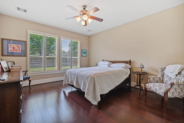 14418 Brushy Arbor Ln, Humble, TX 77396 - bedroom featuring baseboards, dark wood-style floors, and a ceiling fan