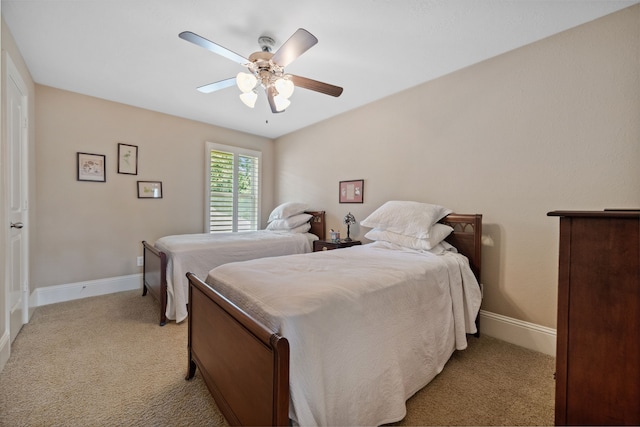 14418 Brushy Arbor Ln, Humble, TX 77396 - bedroom with light colored carpet, baseboards, and ceiling fan