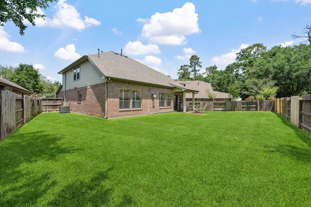 14418 Brushy Arbor Ln, Humble, TX 77396 - rear view of house featuring brick siding, cooling unit, and a shingled roof
