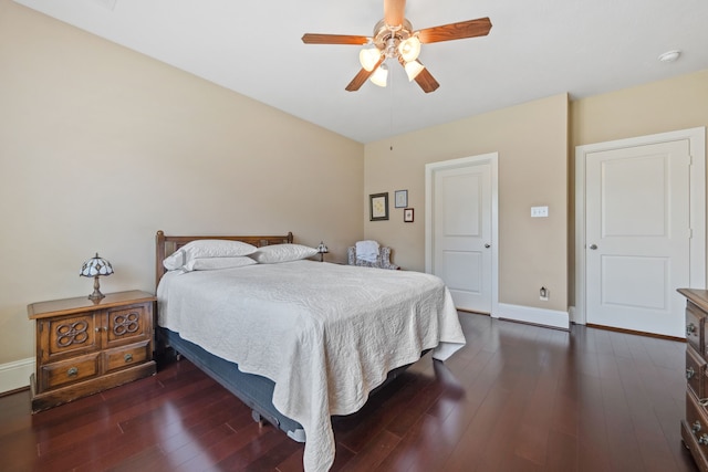 14418 Brushy Arbor Ln, Humble, TX 77396 - bedroom featuring dark wood-style floors, baseboards, and ceiling fan
