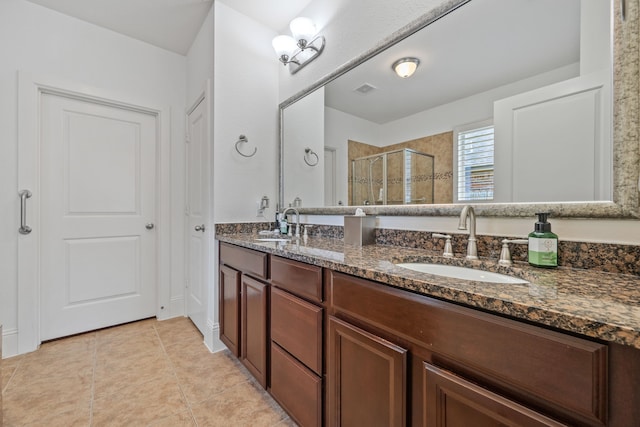 14418 Brushy Arbor Ln, Humble, TX 77396 - bathroom featuring double vanity, a stall shower, and tile patterned flooring