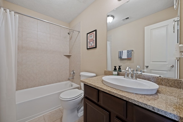 14418 Brushy Arbor Ln, Humble, TX 77396 - full bathroom with vanity, shower / tub combo, toilet, tile patterned flooring, and a textured ceiling
