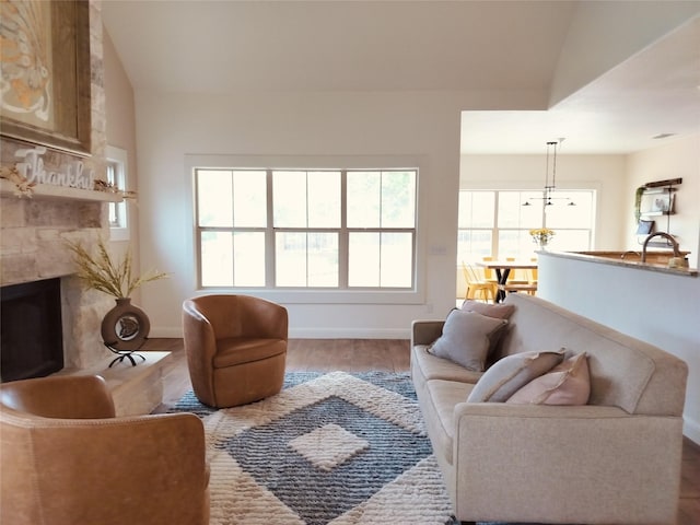 127 Augusta Dr, Woodcreek, TX 78676 - living room featuring wood finished floors, a high end fireplace, and baseboards