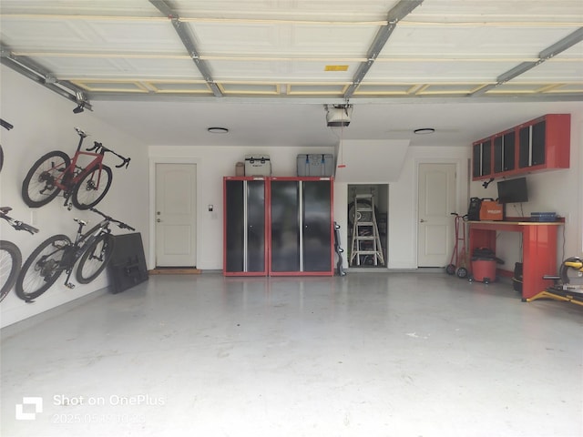 127 Augusta Dr, Woodcreek, TX 78676 - garage featuring a garage door opener