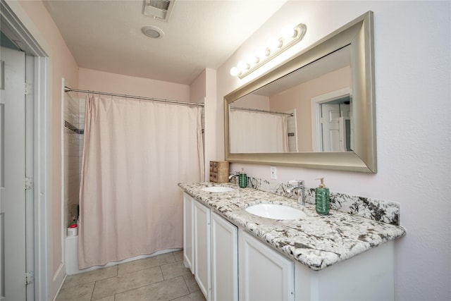 2116 Carter St, Houston, TX 77008 - bathroom with double vanity, tile patterned flooring, and shower / bath combo
