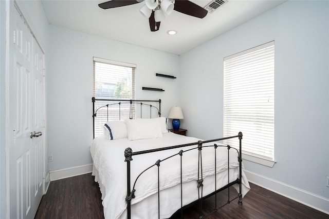 2116 Carter St, Houston, TX 77008 - bedroom with a closet, baseboards, wood finished floors, and a ceiling fan