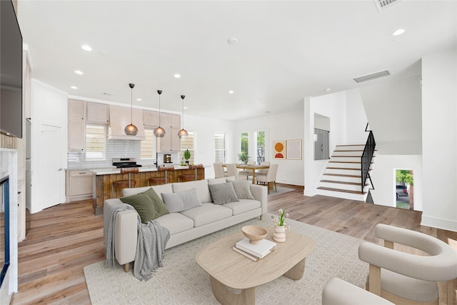5439 Darling St, Houston, TX 77007 - living room featuring light wood-style flooring, stairway, recessed lighting, and baseboards