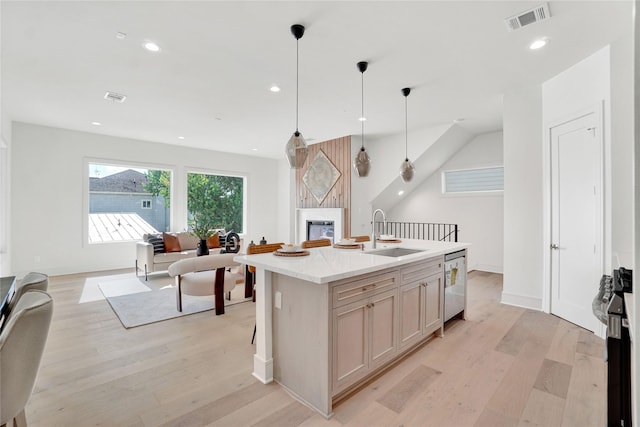 5439 Darling St, Houston, TX 77007 - kitchen featuring a sink, light wood-type flooring, range, a large fireplace, and recessed lighting