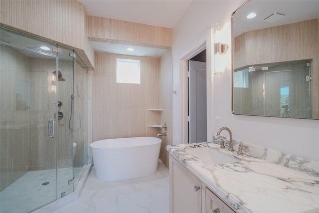 5439 Darling St, Houston, TX 77007 - bathroom featuring vanity, a freestanding bath, a stall shower, and marble finish floors