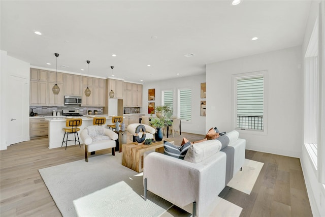 5439 Darling St, Houston, TX 77007 - living area with recessed lighting, light wood-style flooring, and baseboards