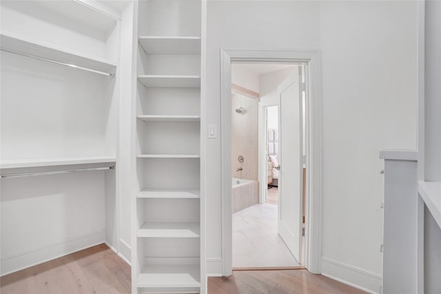 5439 Darling St, Houston, TX 77007 - walk in closet with wood finished floors