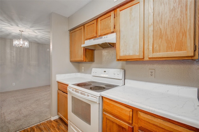 9700 Leawood Blvd Unit 7/16, Houston, TX 77099 - kitchen featuring white range with electric stovetop, under cabinet range hood, light countertops, a chandelier, and dark wood-style floors
