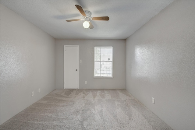 9700 Leawood Blvd Unit 7/16, Houston, TX 77099 - spare room featuring a ceiling fan and carpet