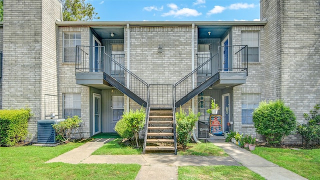 9700 Leawood Blvd Unit 7/16, Houston, TX 77099 - view of property featuring stairs and central AC unit