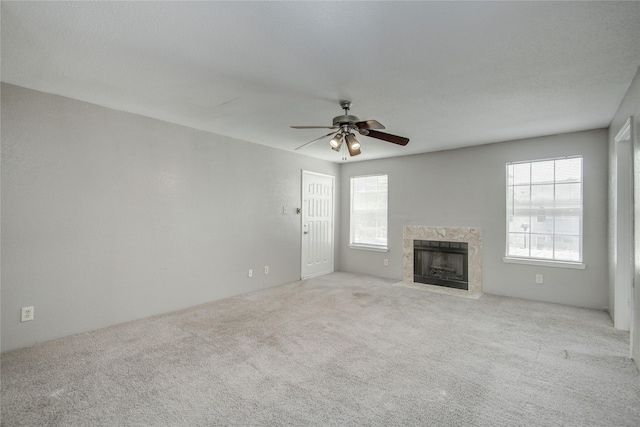 9700 Leawood Blvd Unit 7/16, Houston, TX 77099 - unfurnished living room featuring healthy amount of natural light, carpet floors, and ceiling fan