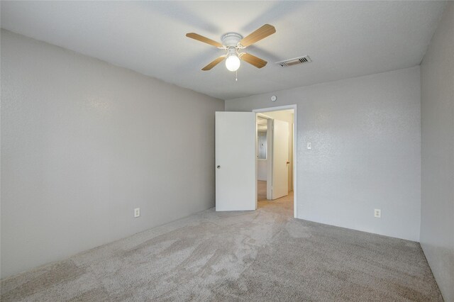 9700 Leawood Blvd Unit 7/16, Houston, TX 77099 - unfurnished room featuring carpet and ceiling fan