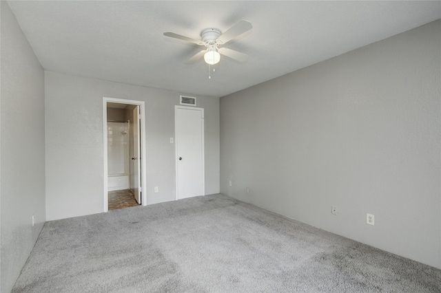 9700 Leawood Blvd Unit 7/16, Houston, TX 77099 - unfurnished bedroom with carpet, ensuite bath, and ceiling fan