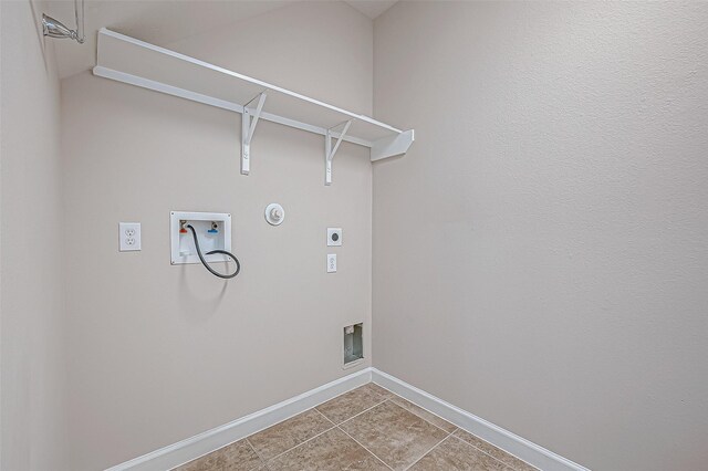8231 Groveland Hills Dr, Cypress, TX 77433 - laundry room with hookup for an electric dryer, hookup for a washing machine, baseboards, hookup for a gas dryer, and tile patterned floors