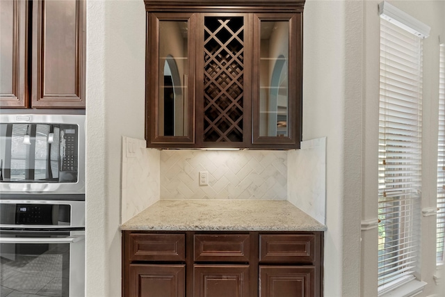 6015 Verde Place Ln, Katy, TX 77493 - bar area with appliances with stainless steel finishes and backsplash