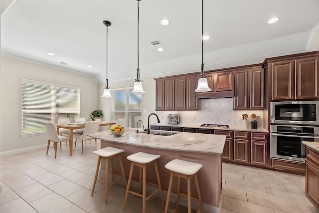 6015 Verde Place Ln, Katy, TX 77493 - kitchen with appliances with stainless steel finishes, a sink, tasteful backsplash, a kitchen bar, and crown molding