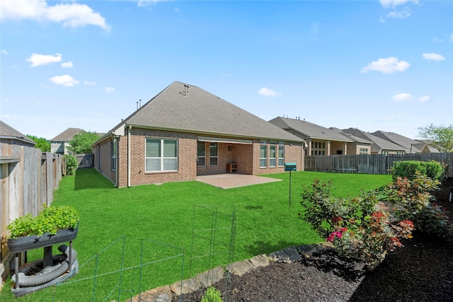 6015 Verde Place Ln, Katy, TX 77493 - rear view of house with brick siding, a patio area, and roof with shingles