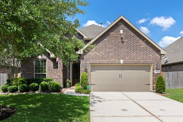 24119 Blue Crest Dr, Porter, TX 77365 - view of front of house featuring brick siding, a garage, driveway, and roof with shingles