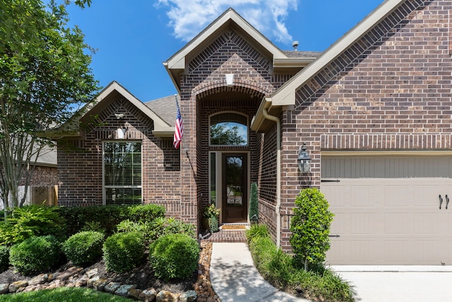 24119 Blue Crest Dr, Porter, TX 77365 - doorway to property featuring brick siding and an attached garage