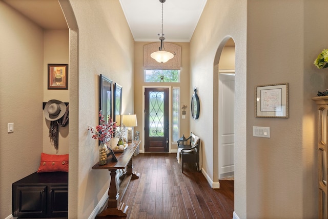 24119 Blue Crest Dr, Porter, TX 77365 - entrance foyer featuring arched walkways, dark wood-style floors, baseboards, and a high ceiling