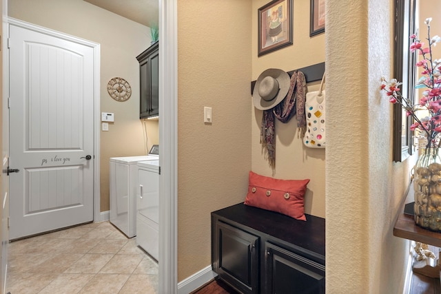 24119 Blue Crest Dr, Porter, TX 77365 - laundry area with cabinet space, independent washer and dryer, light tile patterned floors, and a textured wall