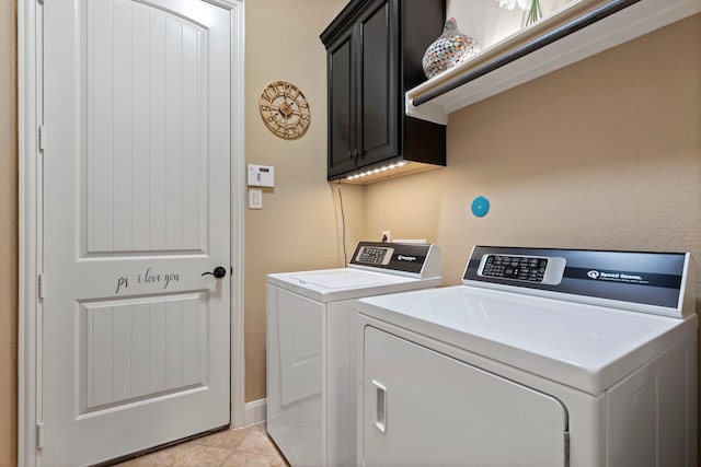 24119 Blue Crest Dr, Porter, TX 77365 - laundry room with cabinet space, washing machine and clothes dryer, and light tile patterned floors
