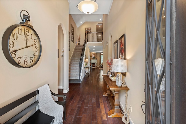24119 Blue Crest Dr, Porter, TX 77365 - foyer entrance with stairway, baseboards, hardwood / wood-style floors, high vaulted ceiling, and arched walkways