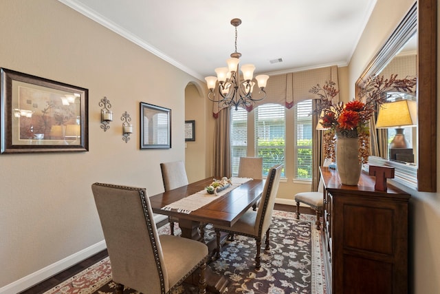 24119 Blue Crest Dr, Porter, TX 77365 - dining room with dark wood-style floors, baseboards, a chandelier, arched walkways, and crown molding
