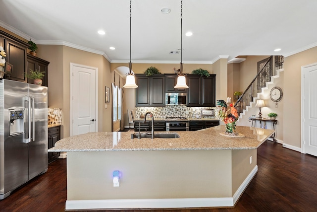 24119 Blue Crest Dr, Porter, TX 77365 - kitchen with stainless steel appliances, a sink, decorative backsplash, recessed lighting, and dark brown cabinetry