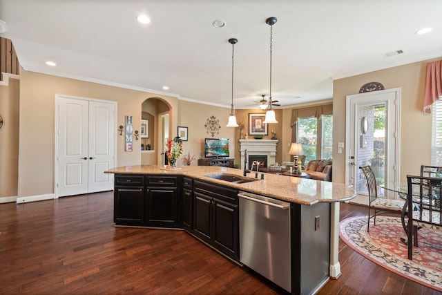 24119 Blue Crest Dr, Porter, TX 77365 - kitchen with dishwasher, a sink, a ceiling fan, dark wood-style flooring, and a warm lit fireplace