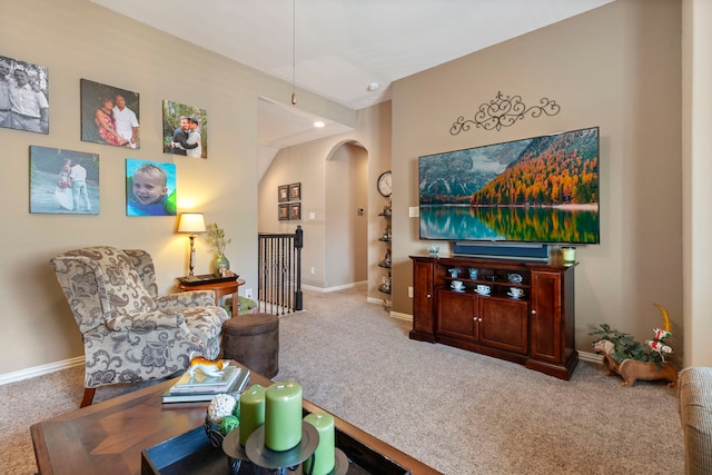 24119 Blue Crest Dr, Porter, TX 77365 - living area with arched walkways, carpet, and baseboards