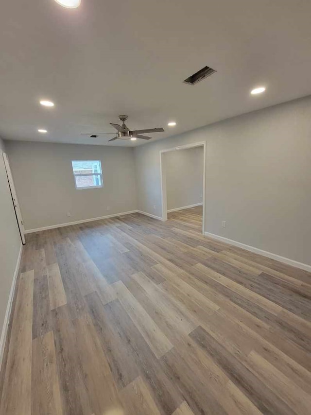 6698 Verde St, Groves, TX 77619 - spare room featuring ceiling fan, light wood-type flooring, recessed lighting, and baseboards