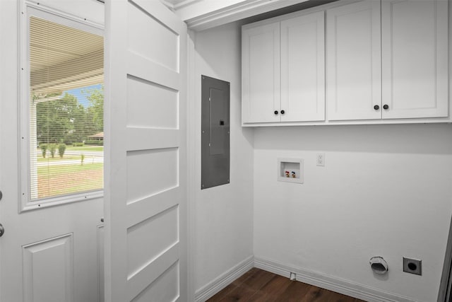 809 E Bowie Ave, Crockett, TX 75835 - laundry room featuring cabinet space, hookup for an electric dryer, electric panel, baseboards, and dark wood-style floors