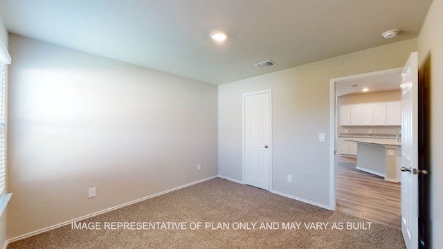 12512 Tarres Ct, Lorena, TX 76655 - unfurnished bedroom with light carpet, baseboards, recessed lighting, and a closet