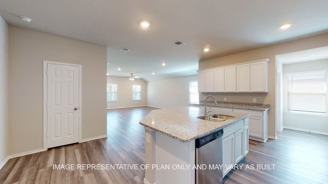 12512 Tarres Ct, Lorena, TX 76655 - kitchen with a sink, dishwasher, wood finished floors, white cabinets, and baseboards