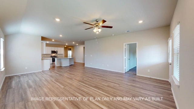 12512 Tarres Ct, Lorena, TX 76655 - unfurnished living room with ceiling fan, light wood-style flooring, baseboards, and recessed lighting