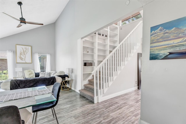 19011 Sandia Pines Dr, Humble, TX 77346 - staircase featuring high vaulted ceiling, baseboards, wood finished floors, and ceiling fan
