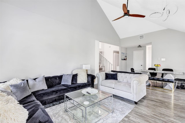 19011 Sandia Pines Dr, Humble, TX 77346 - living room featuring stairway, high vaulted ceiling, ceiling fan, and wood finished floors