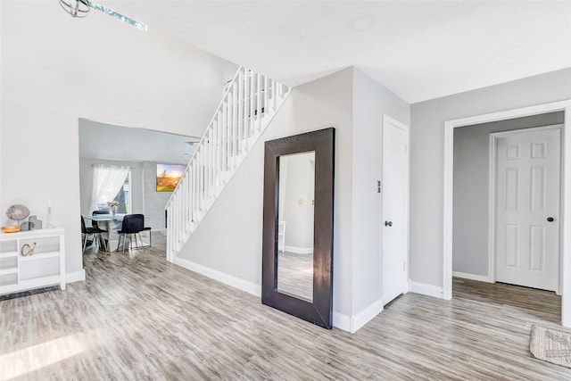 19011 Sandia Pines Dr, Humble, TX 77346 - entryway featuring wood finished floors, stairs, and baseboards