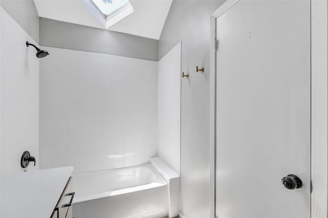 19011 Sandia Pines Dr, Humble, TX 77346 - full bath with a skylight, vaulted ceiling,  shower combination, and vanity