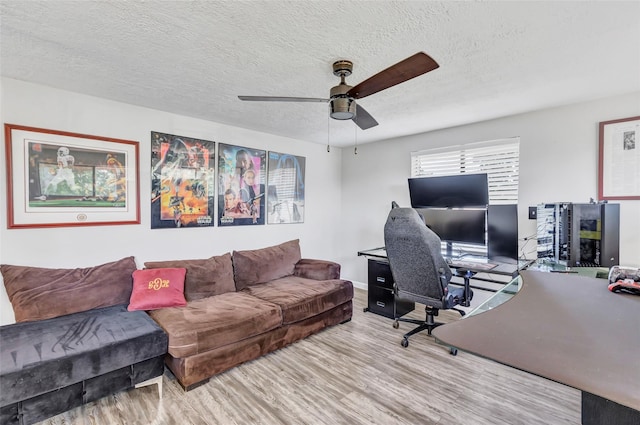 19011 Sandia Pines Dr, Humble, TX 77346 - office area featuring wood finished floors, ceiling fan, a textured ceiling, and baseboards