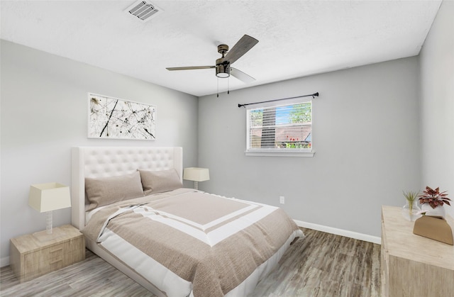 19011 Sandia Pines Dr, Humble, TX 77346 - bedroom with wood finished floors, baseboards, and ceiling fan