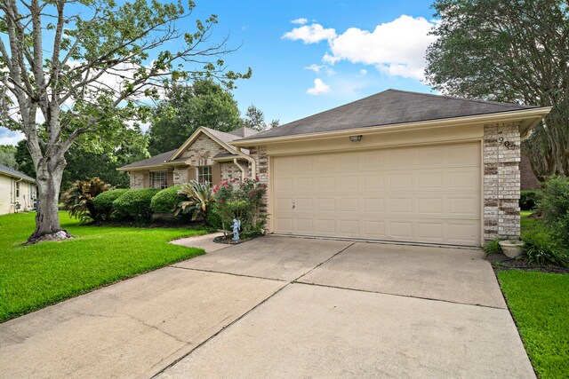 907 S Peach Hollow Ct, Pearland, TX 77584 - single story home with driveway, an attached garage, a front lawn, and brick siding